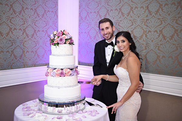 Reunion-Resort-Jewish-Wedding-A-Chair-Affair-Rhodes-Studios-cake-cutting.jpg