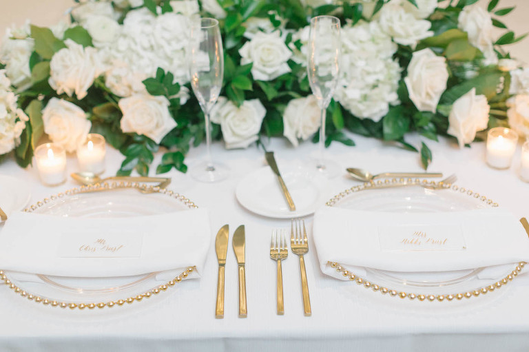 Wedding Reception gold and white place settings