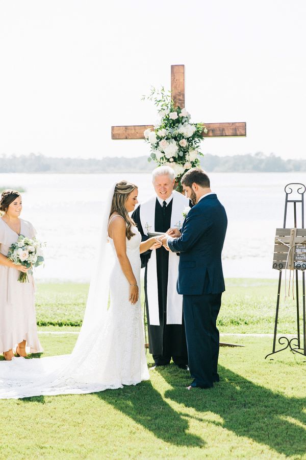 Lakeside Wedding at Lake Mary Events Center A Chair Affair Mahogany Wooden Cross