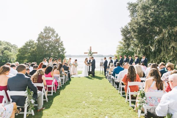 Lakeside Wedding at Lake Mary Events Center A Chair Affair Mahogany Wooden Cross