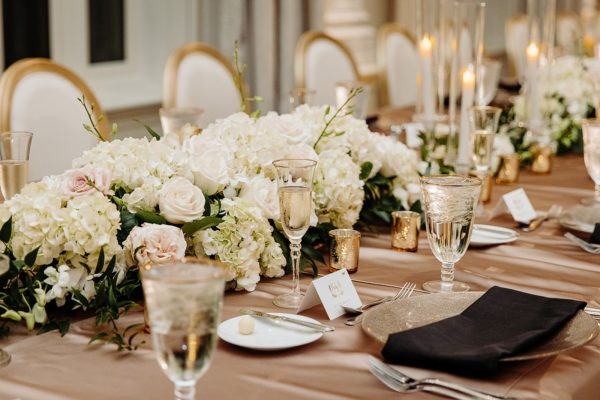 Sunset Wedding at The Vinoy Renaissance Resort and Golf Club A Chair Affair Latte Lamour Linen champagne glitter chargers bright champagne Lamour linen gold rim water and champagne goblets