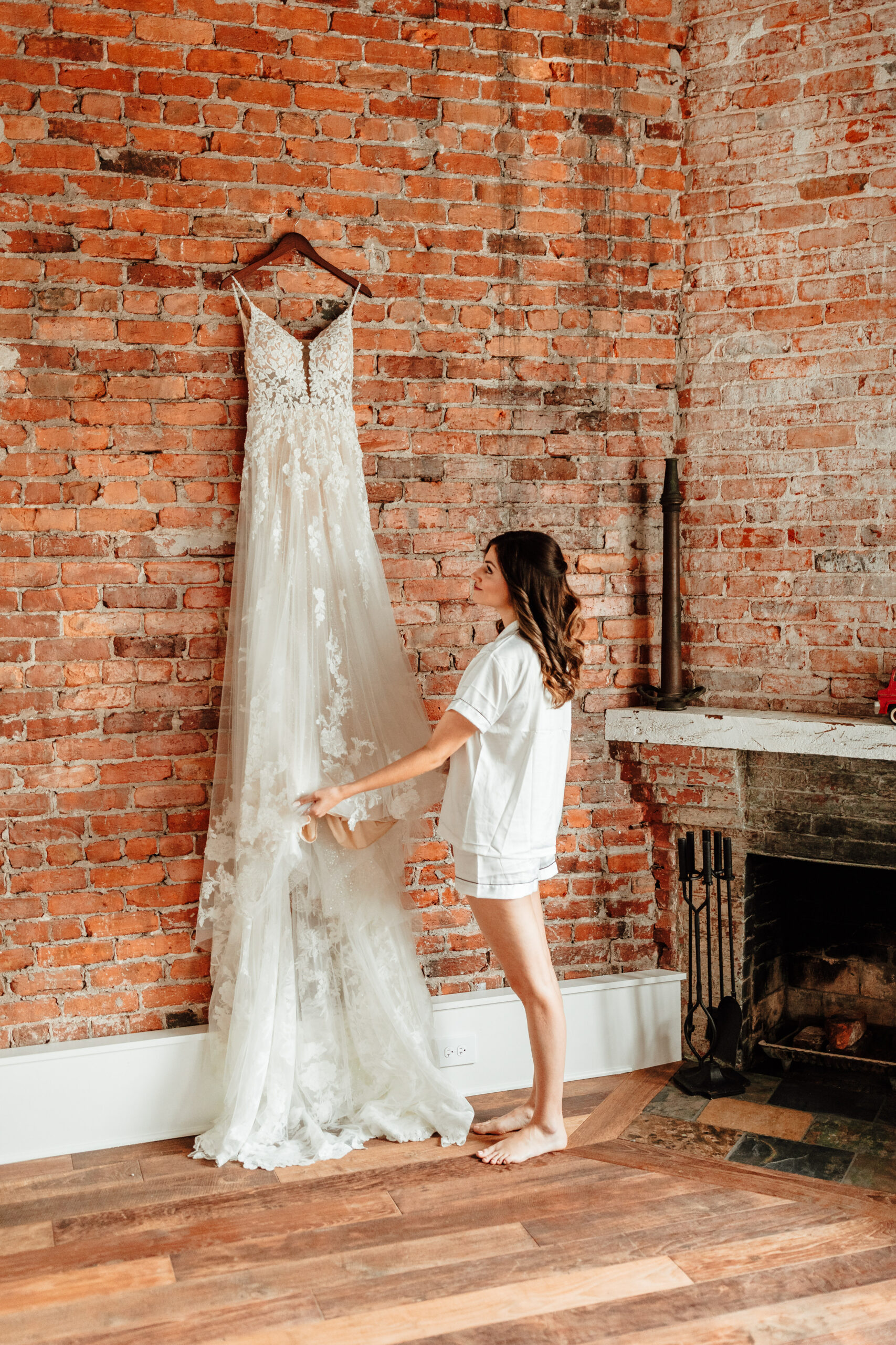 bride-admiring-dress