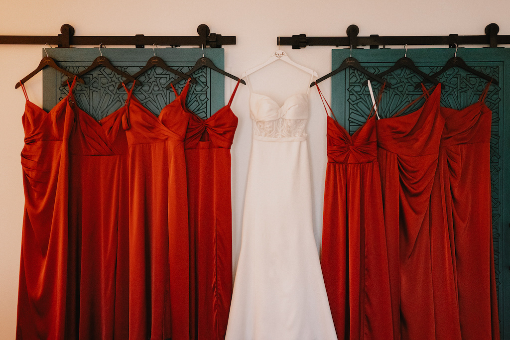 terracotta bridesmaids dresses and white bridal gown