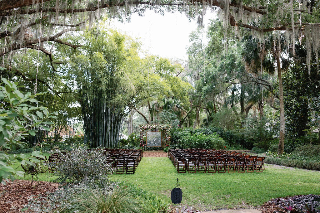 Rustic ceremony with mahogany folding chairs