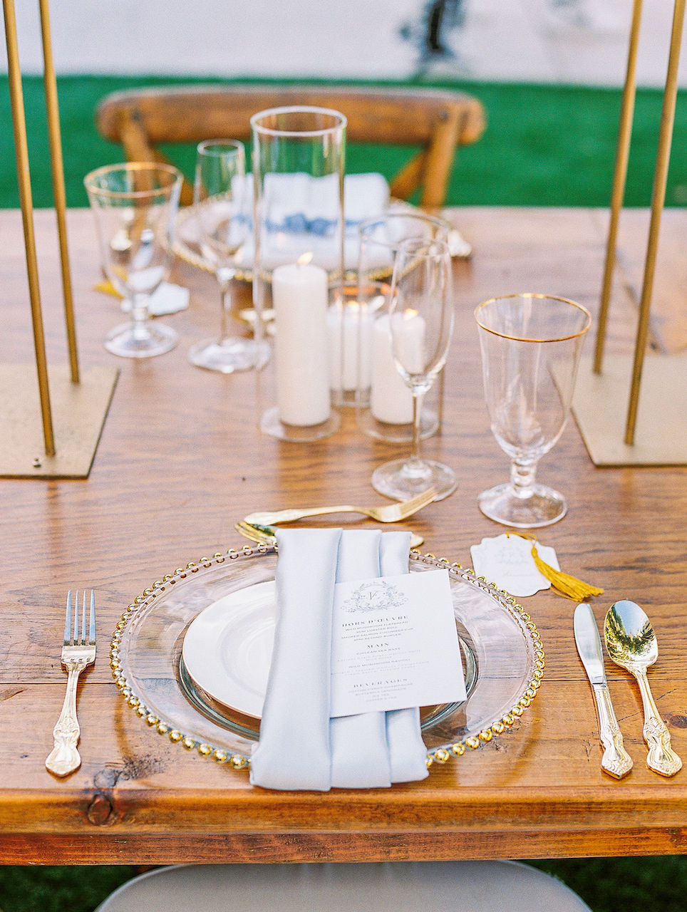 Monaco Tables French Country Chairs, Gold Round Belmont Chargers, Nouville plates, Gold Rimmed Water Goblets, Gold Brushed Flatware