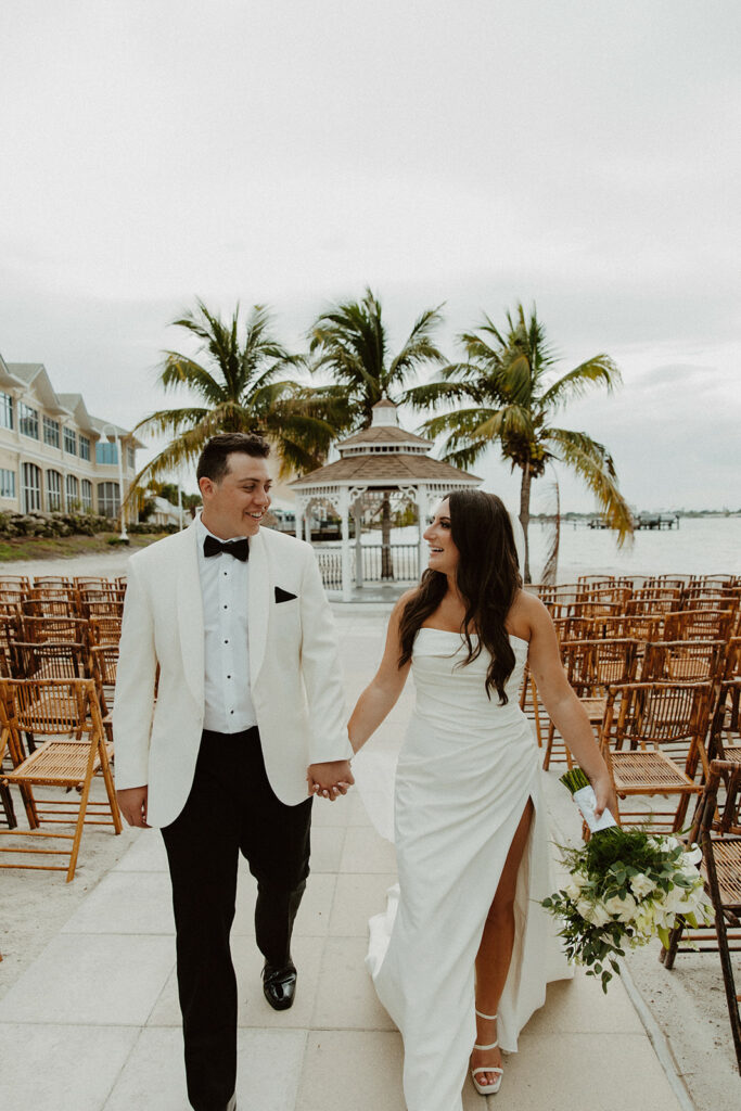 Bryan and Lily at the Isla Del Sol Yacht & Country Club featuring A Chair Affair's Bamboo Wood Folding Chairs.