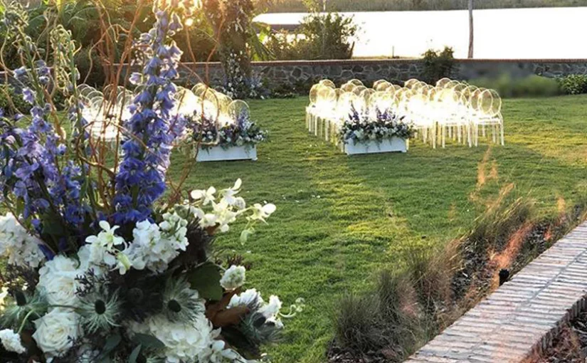 Estate wedding ceremony set up. Wedding rentals Orlando provided Clear Ghost Chairs