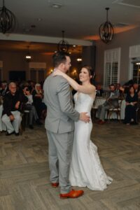 The bride and groom sharing their first dance during the wedding reception.
