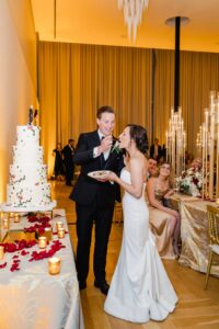 The bride and groom eating cake