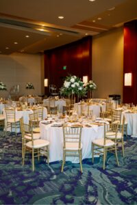 Tampa wedding rentals supplied Gold Chiavari Chairs with Ivory Pads and the White Linens for the tables