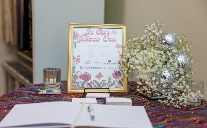 In Our Disco Era sign set on a table and displayed at the open house showcasing all the collaborators