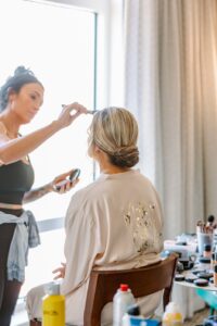 Bridal party getting ready before Longboat Key wedding getting make-up professionally done