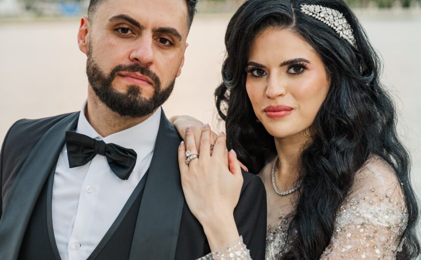 An Elegant Wedding at The Vinoy with bride holding the grooms shoulder