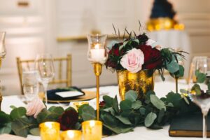 Wedding Rentals Orlando provided Gold Chiavari Chairs and Ivory Pads that were placed along the tables