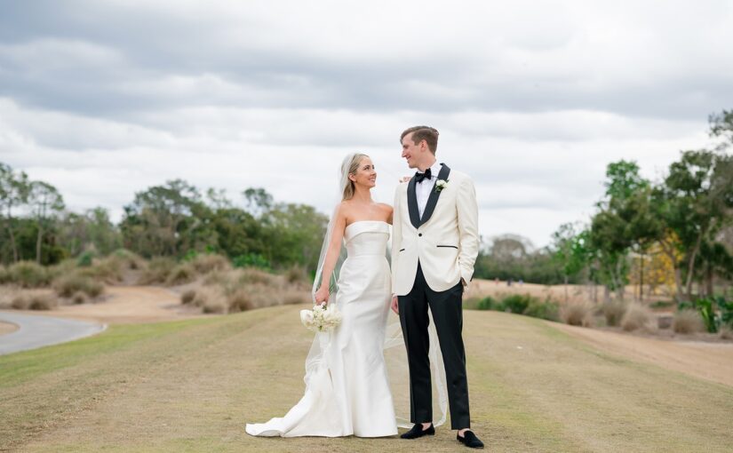 Lauren and JP Langley Wedding on 2/22/25 Bride and groom pictured outdoors in their wedding attire gazing into each others eyes for the photo