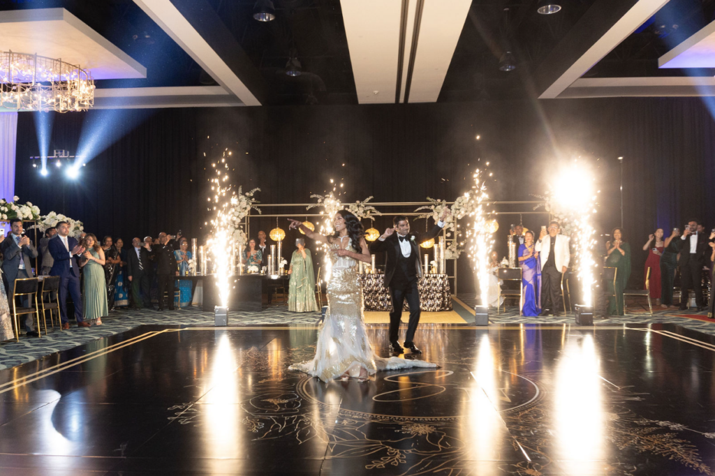 bride and groom with sparklers at reception