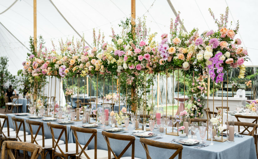 Tables with French Country Chairs and Grace etched water goblet in blush provided by A Chair Affair. Orlando Wedding Rentals.