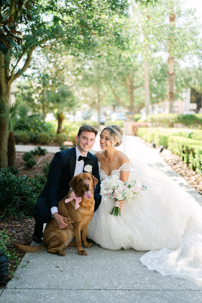 Bride and Groom with their dog from First Look. Orlando Wedding Rentals