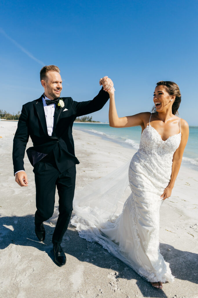 Bride and Groom candid in front of ocean. Sarasota Wedding Rentals