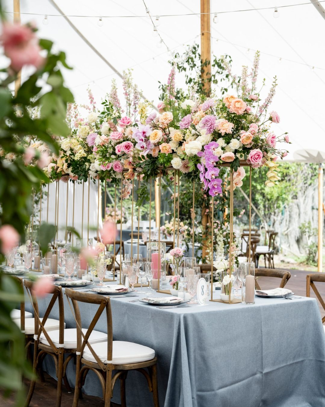 French Country Chairs at a blue table with large floral centerpiece. Orlando Wedding Rentals. Tampa Wedding Rentals. Central Florida Wedding Rentals