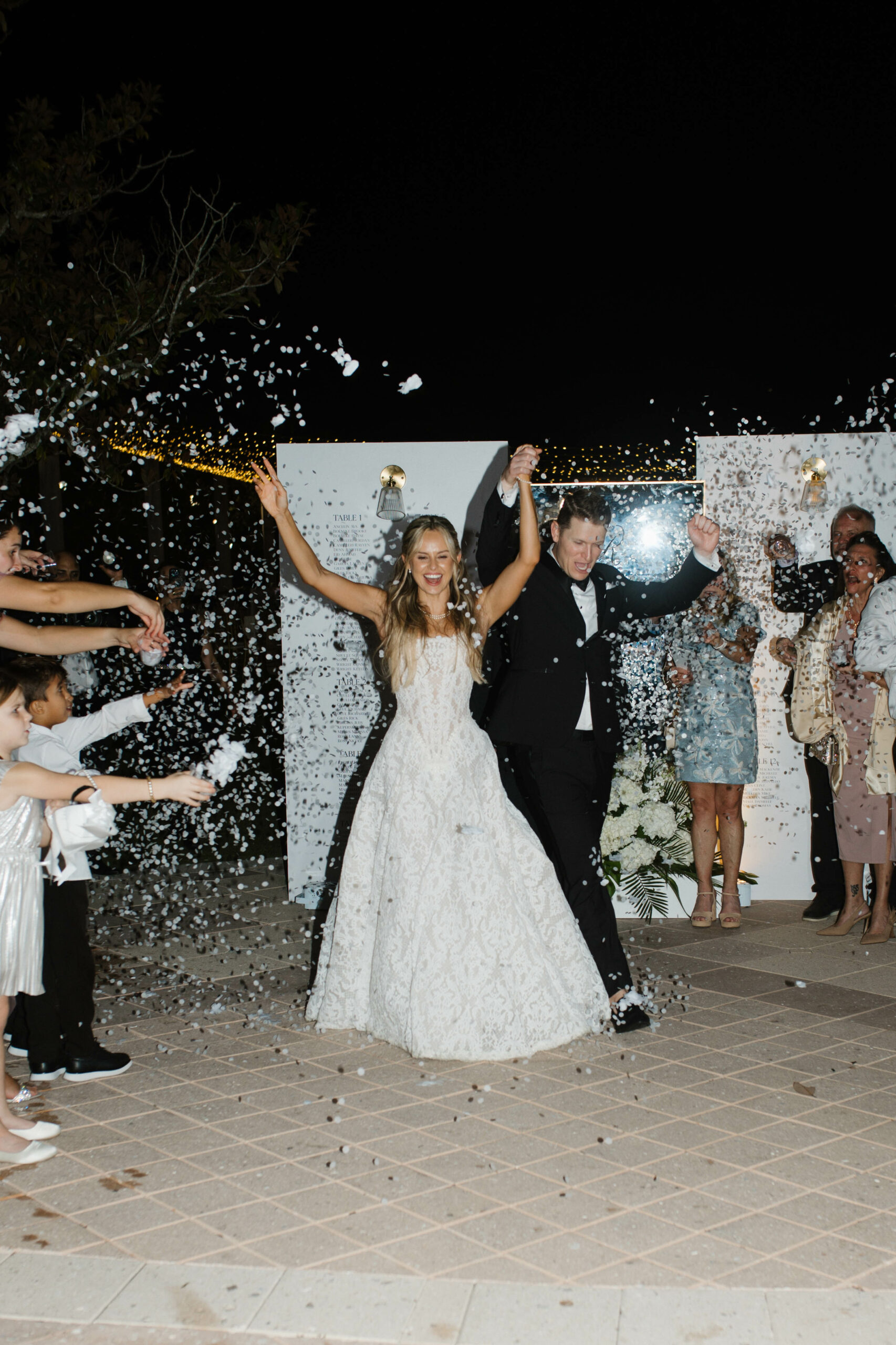 Bride and Groom exiting through bubbles
