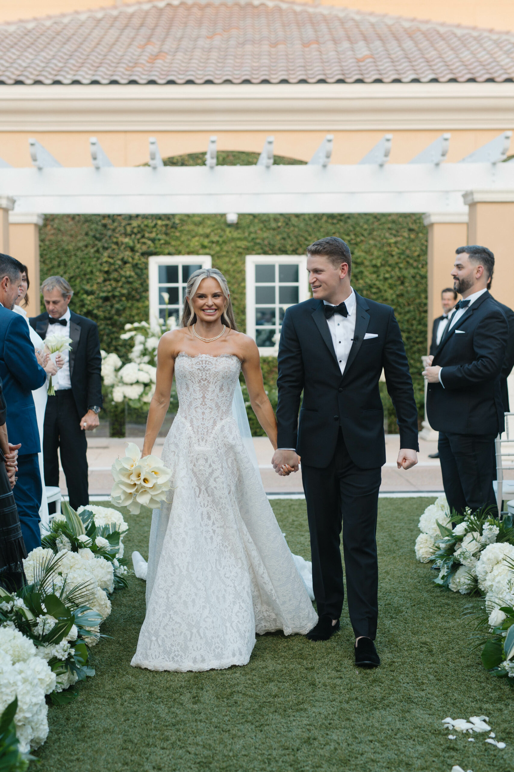 Bride and Groom walking down the aisle at the Ritz Carlton Orlando