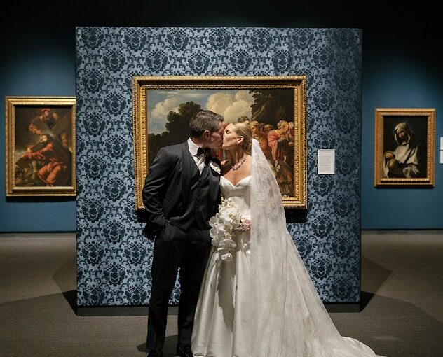 Bride and Groom in front of artwork at the Museum of Fine Art in St Petersburg FLorida. St Petersburg Wedding Rentals. Gold Chiavari Chairs. Tampa Wedding Rentals. Wedding rentals Tampa