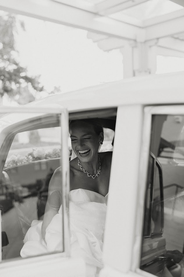 Bride in luxury transportation from AMbassador Limousine
