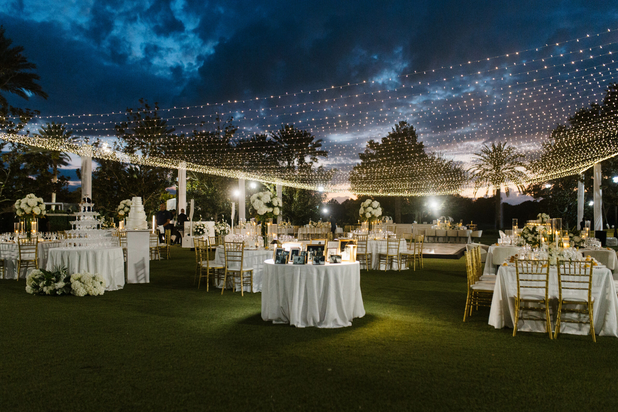 Reception after dark with string lights above.