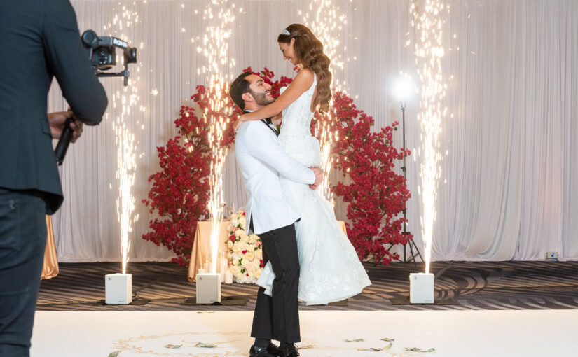 Bride and Groom on dancefloor with sparklers and lifted in air. Tampa Bay Weddings. Tampa Bay Wedding Rentals. Tampa Bay Chiavari CHairs. Central Florida Wedding Rentals.