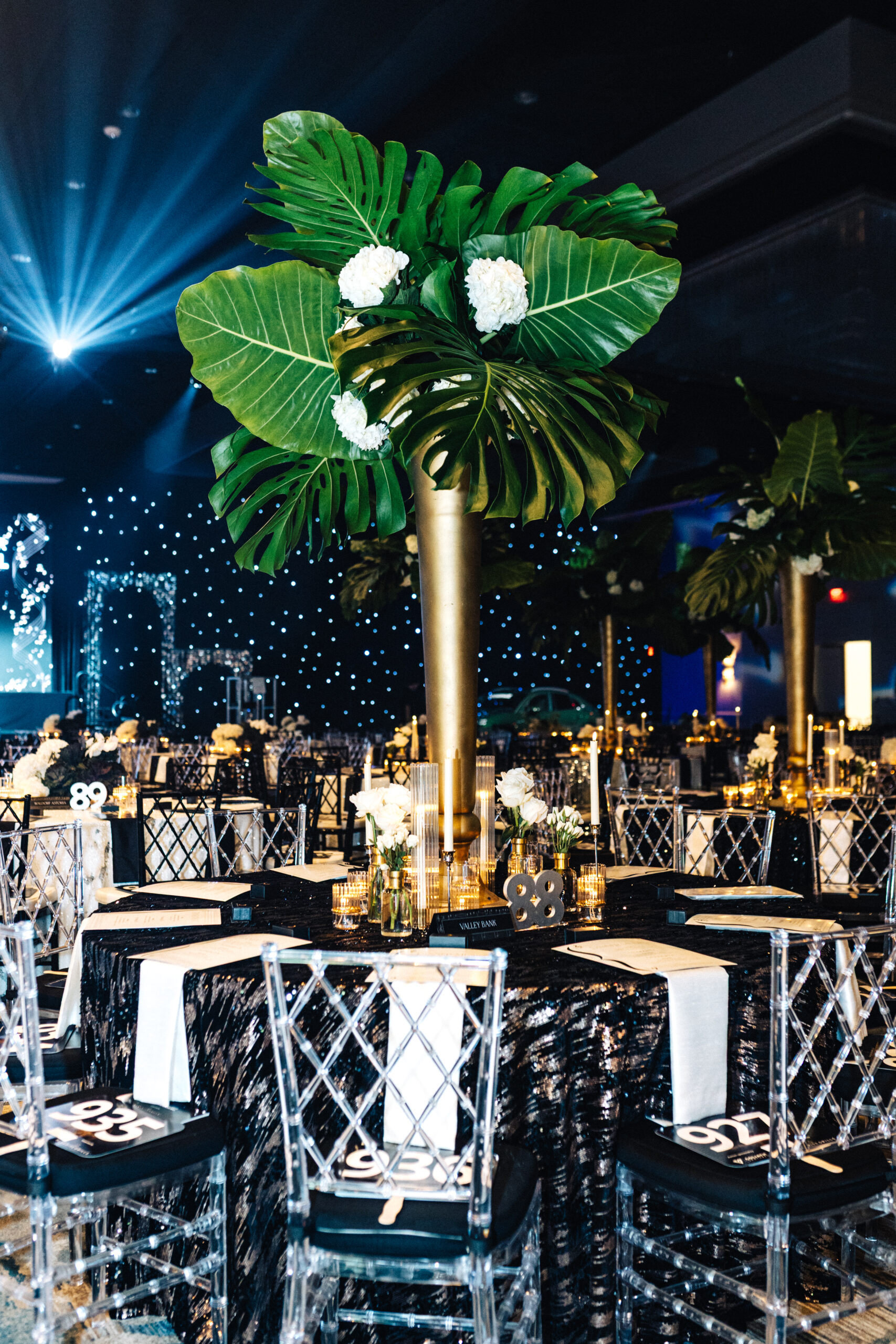 Centerpieces with Clear Wysteria Chairs from A Chair Affair at Kids Beating Cancer Event 2025. Orlando Event Rentals. Orlando Events. Chiavari Chair Rentals. Wysteria Chair Rentals.