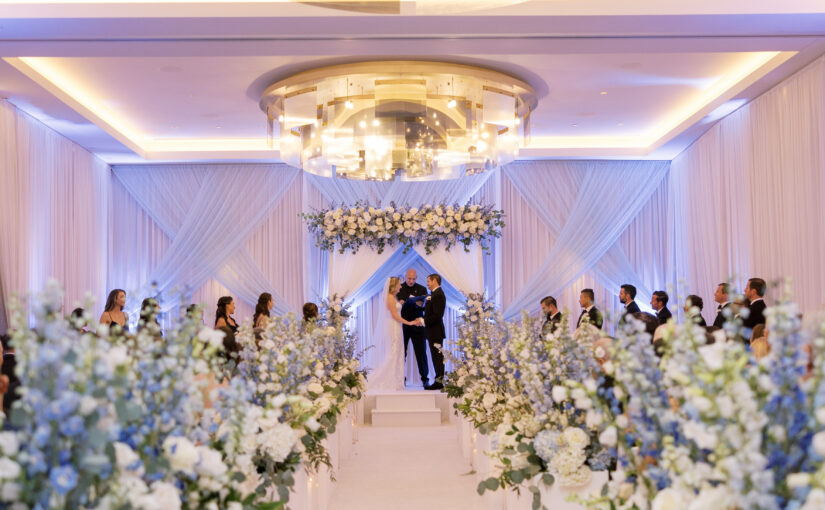 Ceremony at Walt Disney World Swan Reserve with Clear Chiavari CHairs from A Chair Affair. Orlando Wedding. Orlando Wedding Rentals. Orlando Chiavari Chair Rentals.