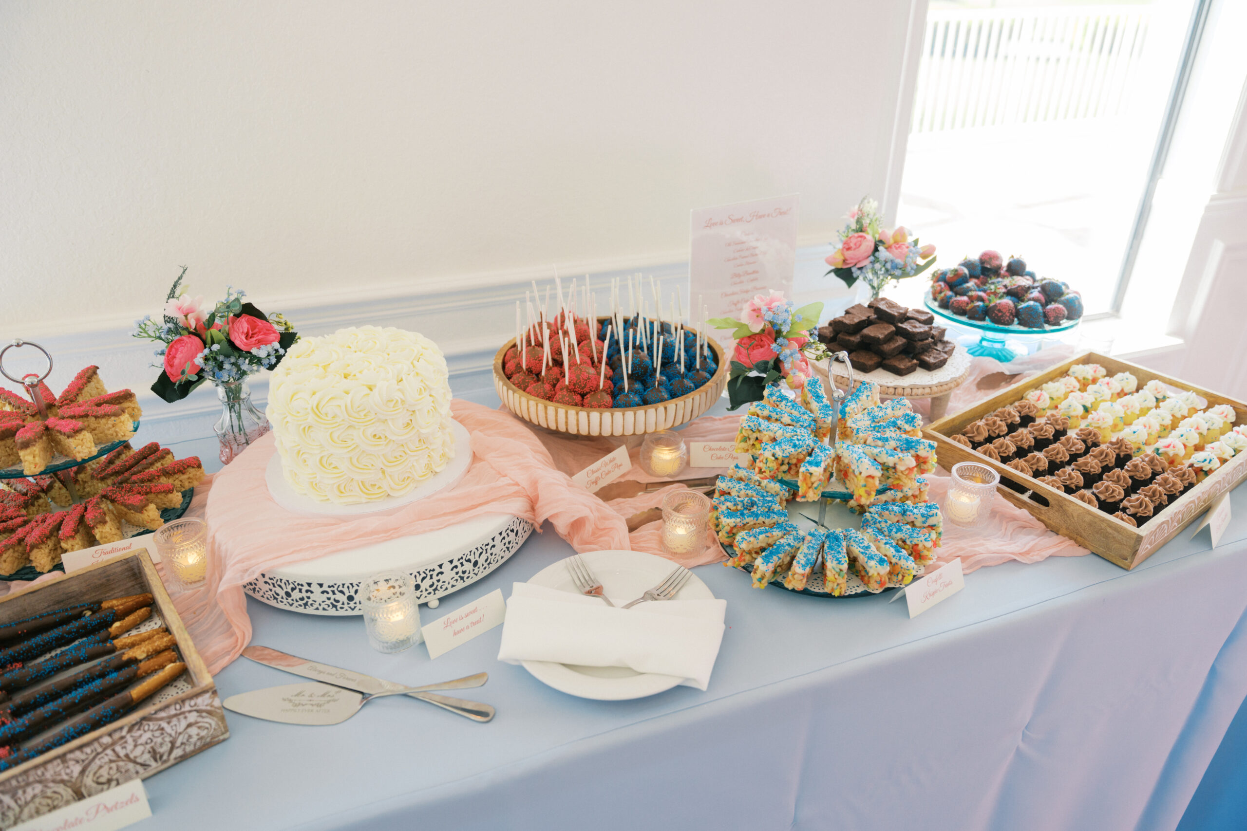Dessert Table at reception featuring cake and assorted treats