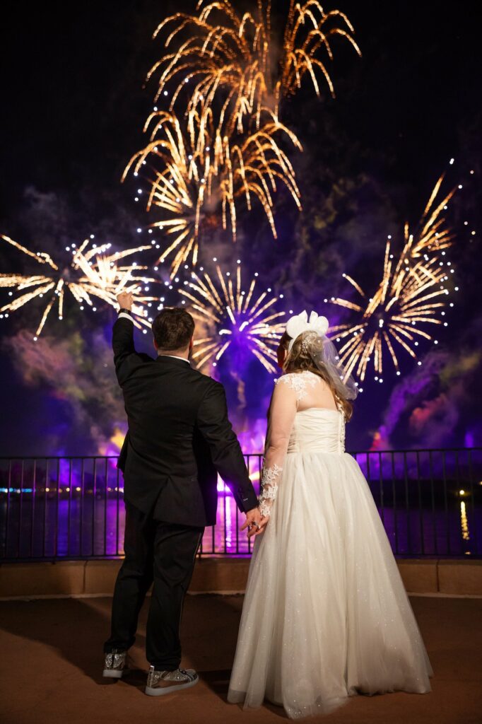 Bride and Groom watching fireworks at EPCOT. Orlando Wedding Rentals. Orlando Chair Rentals. Central Florida Wedding Rentals.