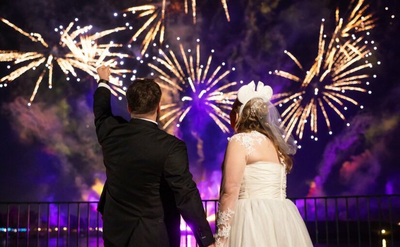 Bride and Groom watching fireworks at EPCOT. Orlando Wedding Rentals. Orlando Chair Rentals. Central Florida Wedding Rentals.