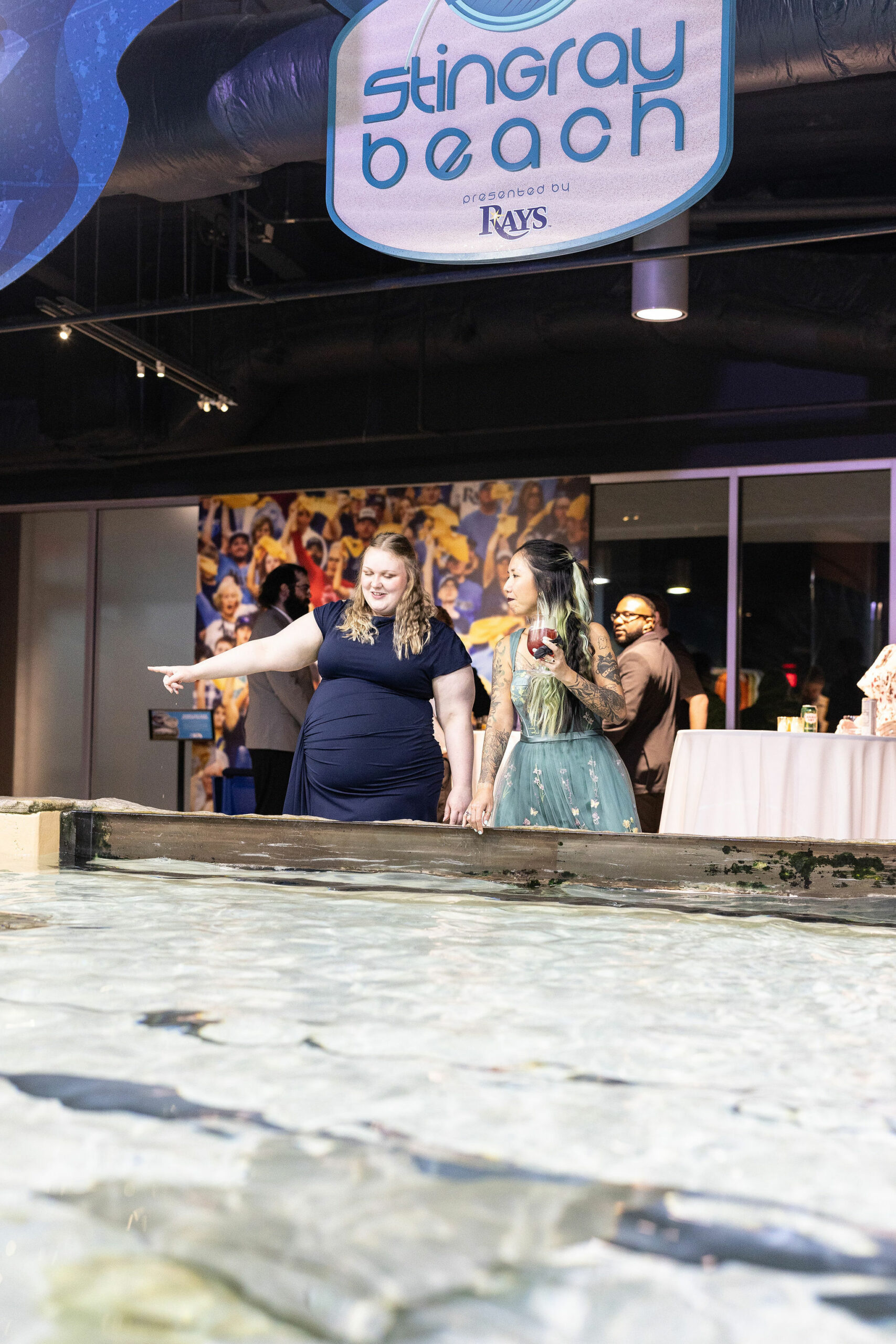 Guests enjoying STingray Beach at Florida Aquarium. with lanterns. Tampa Wedding Rentals. Tampa Chair Rentals. Tampa Chiavari Chairs. Tampa Weddings