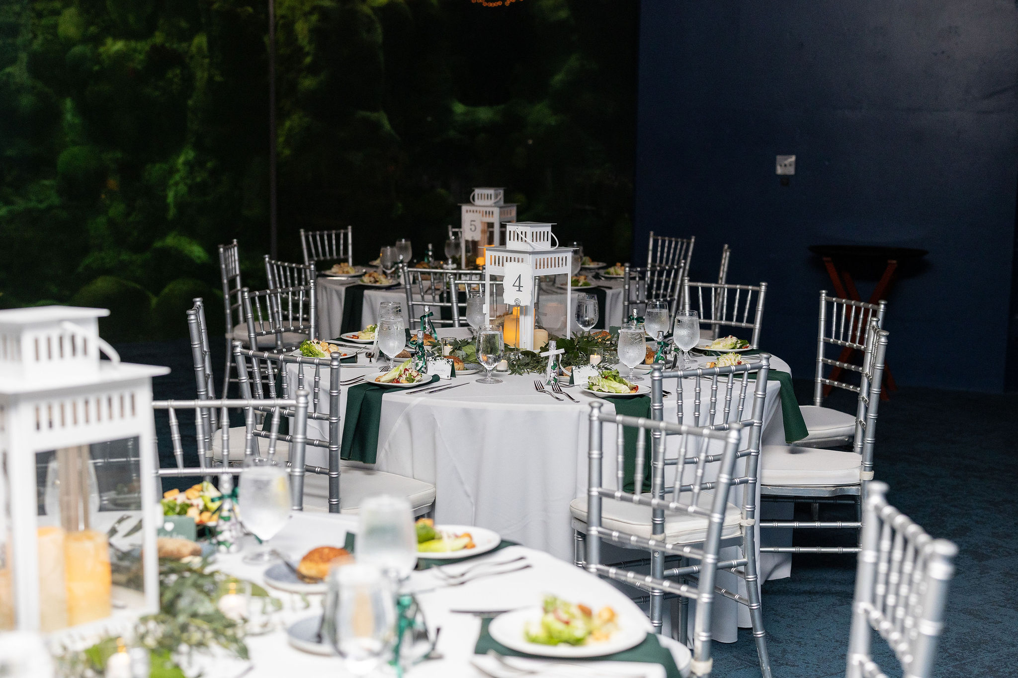 Table View at Florida Aquarium Wedding with Silver Chiavari Chairs from A Chair Affair. with lanterns. Tampa Wedding Rentals. Tampa Chair Rentals. Tampa Chiavari Chairs. Tampa Weddings