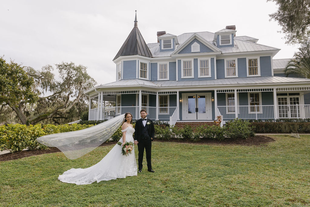 Bride and Groom in front of Highland Manor in Apopka, FL. Reception was at Highland Manor with Grace Etched Blush Water Goblets from A Chair Affair. Orlando Weddings. Orlando Wedding Rentals. Wedding Rentals Orlando. Central Florida Wedding Rentals. Florida Goblet Rentals.