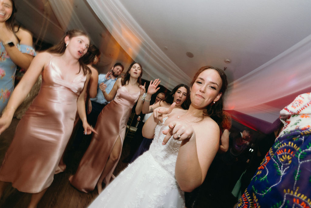 Bride dancing at reception at Highland Manor