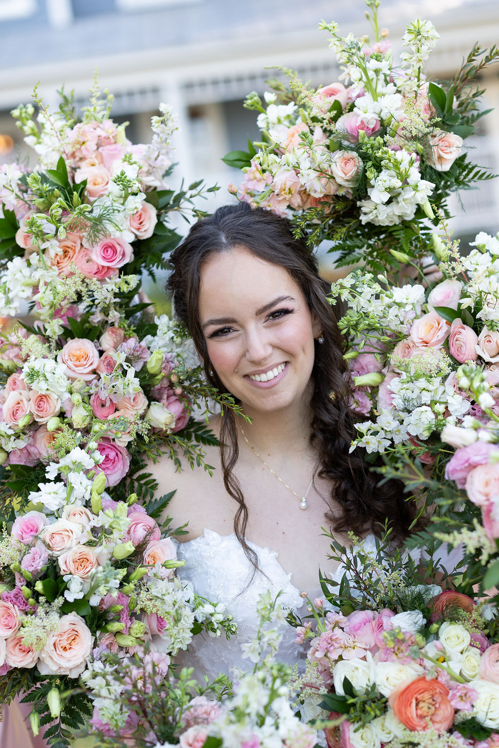 Bride surrounded by bouquets