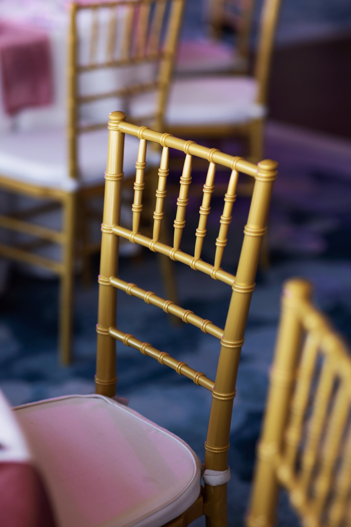 Gold Chiavari Chairs at The Vue at Walt Disney World Swan Reserve. Chiavari Chair Rentals. Orlando Chair Rentals. Orlando Wedding Rentals. Central Florida Wedding Rentals. Central Florida Chair Rentals.