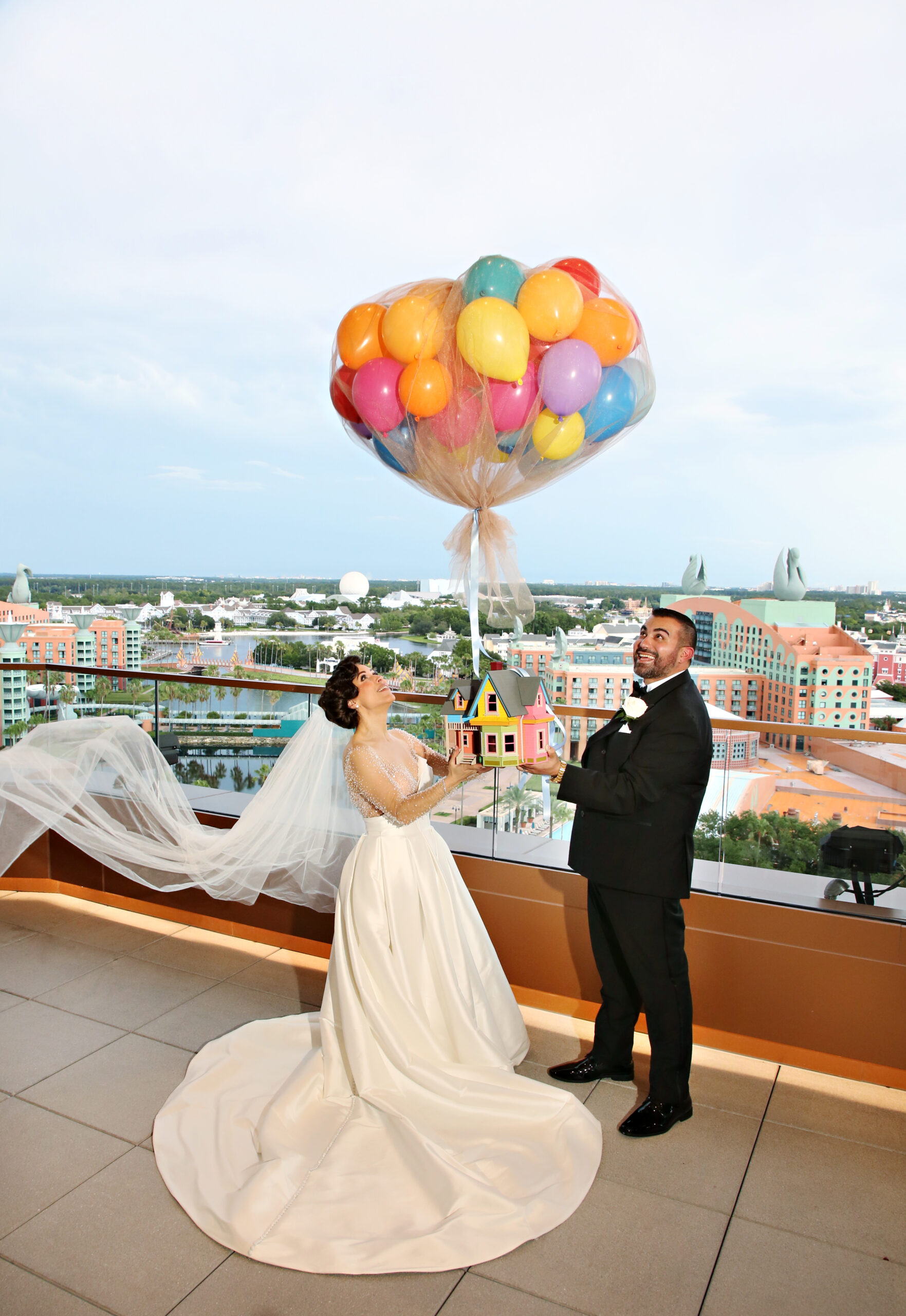 Bride and Groom Up photo with balloons. Central Florida Wedding Rentals. Orlando Wedding Rentals. Chiavari Chair Rentals. Gold Chiavari Chairs. Walt Disney World. Swan and Dolphin Resort. Walt Disney Pictures. Up