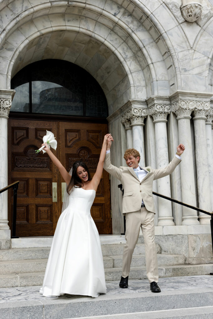 Bride and Groom excitedly exiting church. White Chiavari Chairs provided by A Chair Affair. Central Florida Wedding Rentals. Tampa Wedding Rentals. Tampa Chair Rentals. Chiavari Chairs.