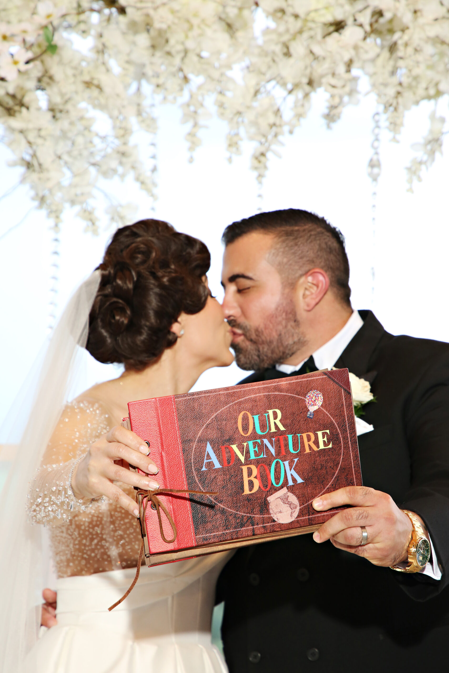 Bride and Groom with their own Adventure Book from the movie Up.