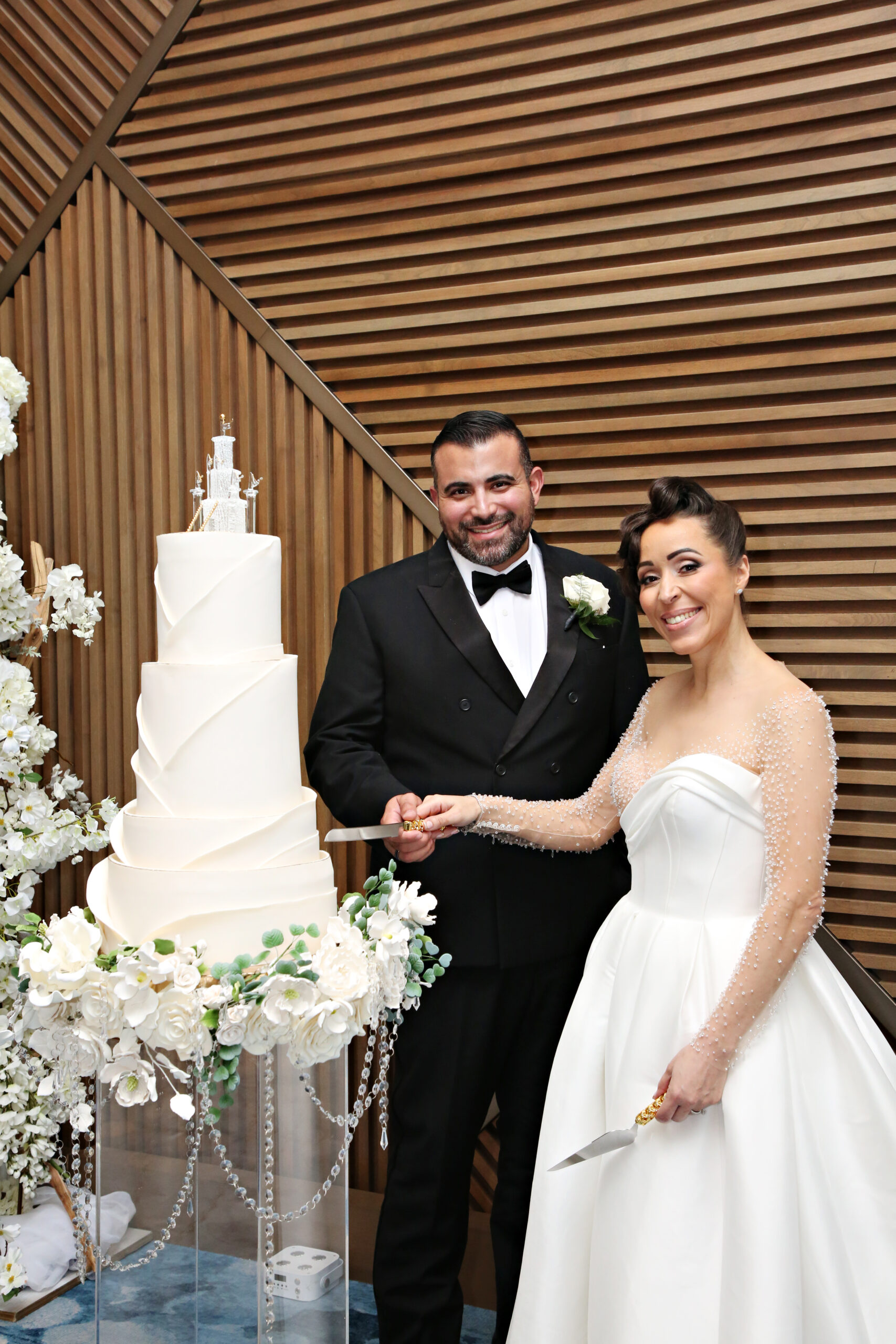 Bride and Groom cutting the cake