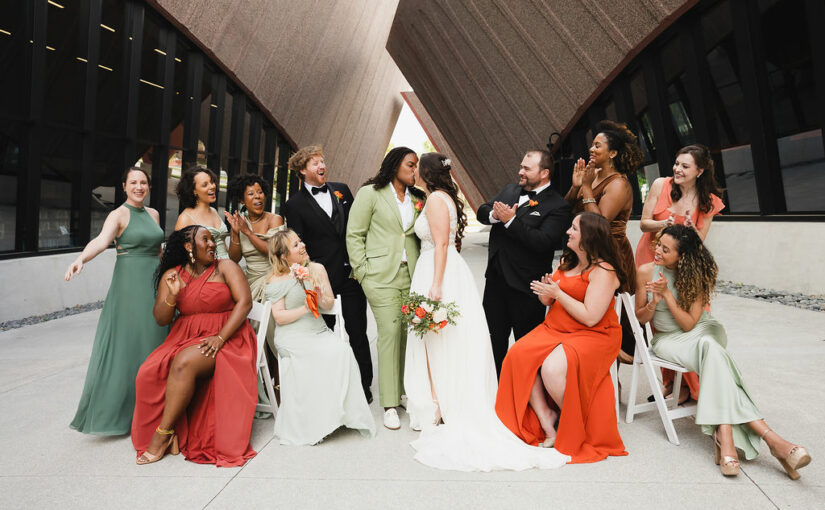 Brides with entire wedding party. Central FLorida Wedding Rentals. Orlando Wedding Rentals. Wintergarden Events Center. Champagne Hedge Wall Rental. Resin Chair Rentals.